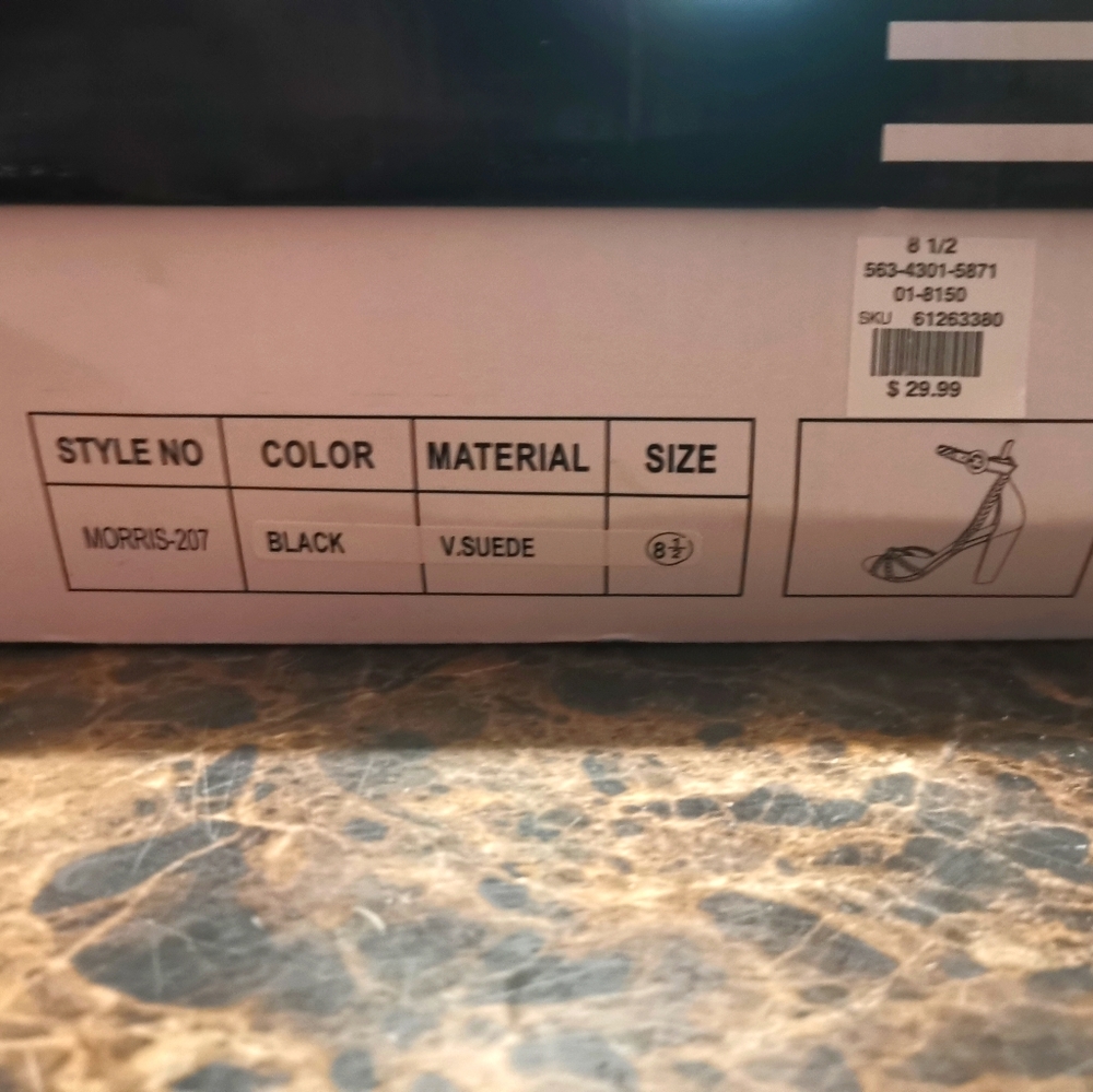 Selling black sued high heels new in box